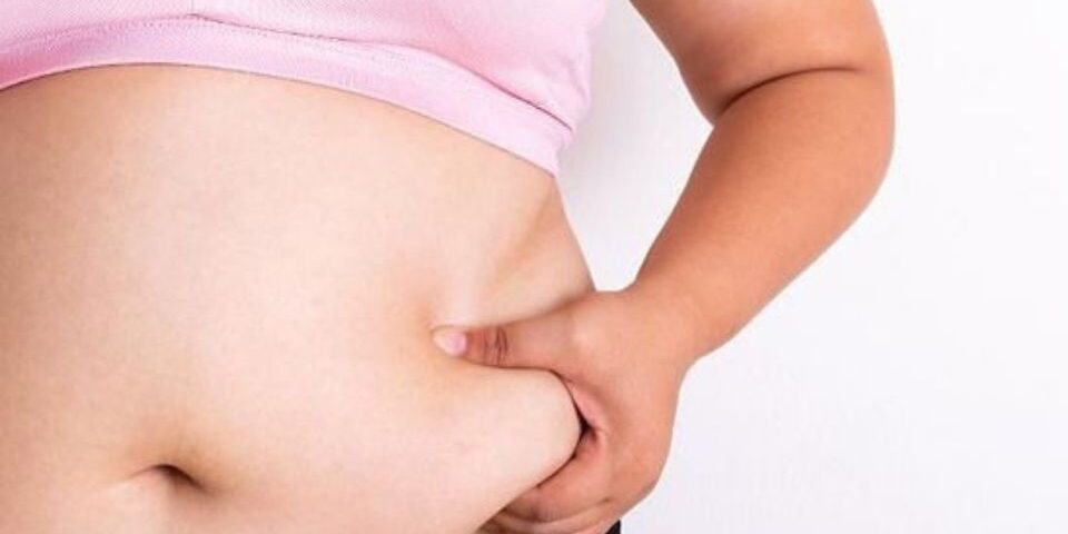 Woman Showning Her Belly Fat